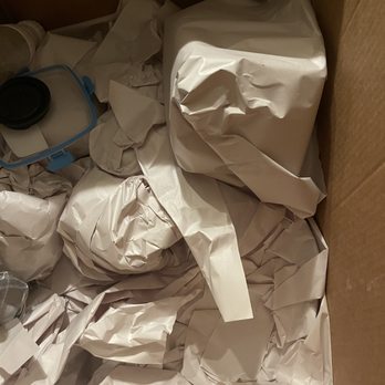 Southwest Movers - Rectangular package is a heavy antique bookend. Smaller packages beneath  are (spoiler alert: were) fine china. - Movers Near Me - San Jose, California