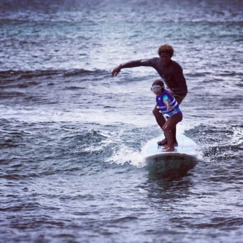 Buttons Surf School - Buttons surfing tandem with my 6 year old daughter. She caught the most waves out of the family! :) - Surfing Near Me - Haleiwa, Hawaii