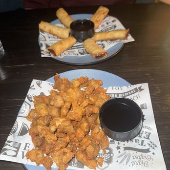 IYKYK - Land & Sea Lumpia and Popcorn Chicken Thighs - Cocktail Bars Near Me - Flushing, New York