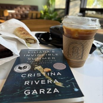 The Well Coffee Bar - Cold brew with sugar free vanilla and splash of oat milk. Coffee shop book pick, Liliana's Invincible Summer. - Coffee & Tea Near Me - Tulare, California The Well Coffee Bar - Cold brew with sugar free vanilla and splash of oat milk. Coffee shop book pick, Liliana's Invincible Summer. - Coffee & Tea Near Me - Tulare, California