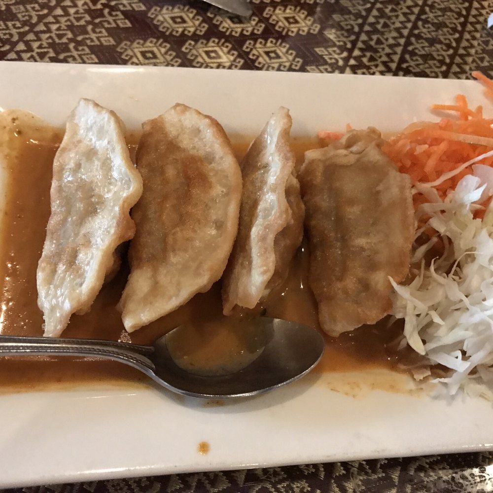 Manee Thai Restaurant - Curry pot stickers. Pork. Red curry sauce. Tasty! - Thai Near Me - Ballwin, Missouri Manee Thai Restaurant - Curry pot stickers. Pork. Red curry sauce. Tasty! - Thai Near Me - Ballwin, Missouri