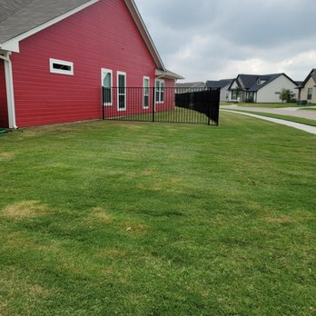 ABC Lawn Service - a red house with a black fence - Lawn Services Near Me ABC Lawn Service - a red house with a black fence - Lawn Services Near Me