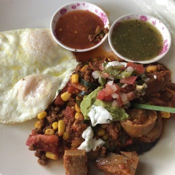Duza's Kitchen - Blue corn Arepa under a sauce of tomatoes jalapeños Italian sausage chorizo and corn - Breakfast & Brunch Near Me - Payson, Arizona