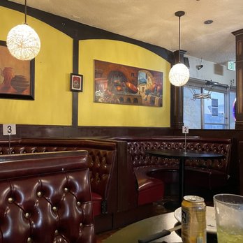 Puro Peru - a view of a dining area with a table and chairs - Peruvian Near Me - Sandy, Utah Puro Peru - a view of a dining area with a table and chairs - Peruvian Near Me - Sandy, Utah