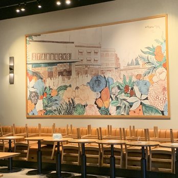 Starbucks - a large mural of flowers and plants on the wall of a coffee shop - Coffee & Tea Near Me - Newnan, Georgia