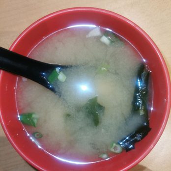 Fuki Sushi Bar - a bowl of soup with a spoon - Sushi Bars Near Me - Laval, Quebec