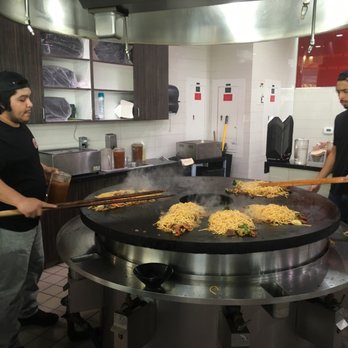 Great Kahn - two men cooking food in a kitchen - Asian Fusion Near Me - Santa Monica, California Great Kahn - two men cooking food in a kitchen - Asian Fusion Near Me - Santa Monica, California
