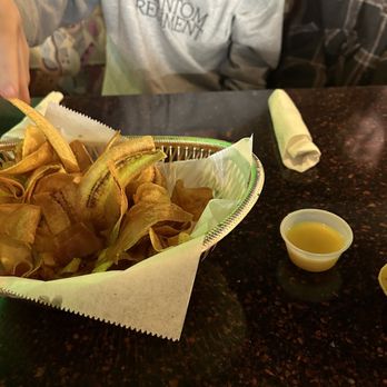 Jessica's Bistro - a person sitting at a table with a bowl of chips - New American Near Me - Lake City, Florida
