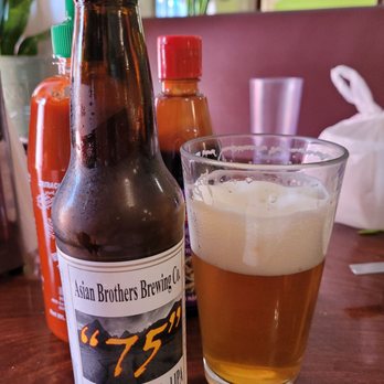 Saigon Village Restaurant - a glass of beer and a bottle of beer - Vietnamese Near Me - San Rafael, California Saigon Village Restaurant - a glass of beer and a bottle of beer - Vietnamese Near Me - San Rafael, California