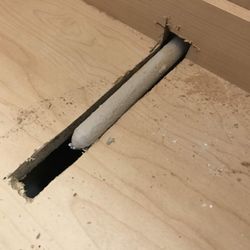 Gardner Plumbing - The druggies installed the water line 12" too low. This is the cabinet bottom.