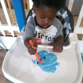 Little Minds Learning Center - Mixing blue and white to create a light shade of blue color. I love his concentration! He is quite the artist. - Child Care & Day Care Near Me - Anaheim, California