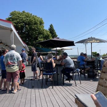 Richard’s Fresh Seafood - a group of people on a deck - Seafood Near Me - Victoria, Prince Edward Island