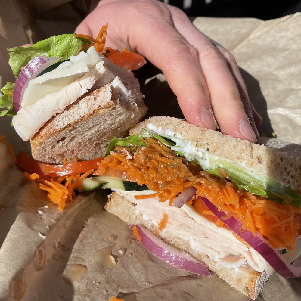 The Village Baker - Garden Turkey - oven-roasted turkey with fresh tomato, cucumber, red onion, carrot, leaf lettuce and provolone cheese with garlic mayonnaise - Bakeries Near Me - Bend, Oregon The Village Baker - Garden Turkey - oven-roasted turkey with fresh tomato, cucumber, red onion, carrot, leaf lettuce and provolone cheese with garlic mayonnaise - Bakeries Near Me - Bend, Oregon