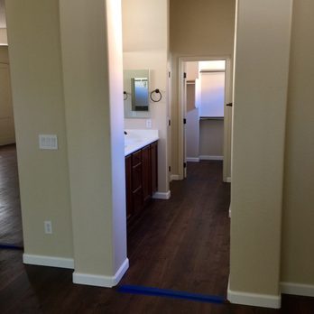 Beck's Floor Installations - Bedroom (where carpet was removed) going into bathroom (where planks were lain over tile). And how everything lines up perfectly! - Flooring Near Me