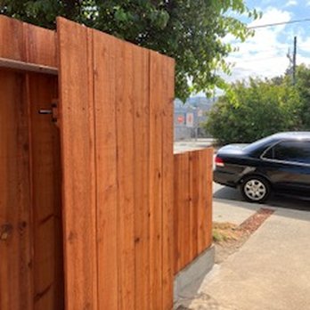 Remodeling Heroes - Open gate showing lower fence to sidewalk - General Contractors Near Me Remodeling Heroes - Open gate showing lower fence to sidewalk - General Contractors Near Me