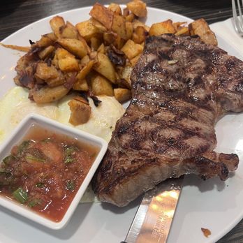 Off Street Cafe - Home Style Potatoes, Rib Eye Steak, 2 eggs and homemade salsa - American Near Me - Cerritos, California Off Street Cafe - Home Style Potatoes, Rib Eye Steak, 2 eggs and homemade salsa - American Near Me - Cerritos, California