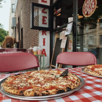 Salsa Pizzeria - two pizzas on a table - Pizza Near Me - Brooklyn, New York Salsa Pizzeria - two pizzas on a table - Pizza Near Me - Brooklyn, New York