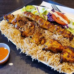 Chicken and kofta with rice and salad, also naan on the side. The creamy sauce was very good, the orange sauce was very spicy!