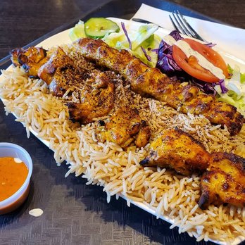 Kandahar Kabab - Chicken and kofta with rice and salad, also naan on the side. The creamy sauce was very good, the orange sauce was very spicy! - Halal Near Me - Toronto, Ontario