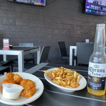 Town House - Boneless wings with buffalo sauce and Cajun fries. As you can see, there are multiple outdoor TVs as well - New American Near Me - Marietta, Ohio Town House - Boneless wings with buffalo sauce and Cajun fries. As you can see, there are multiple outdoor TVs as well - New American Near Me - Marietta, Ohio