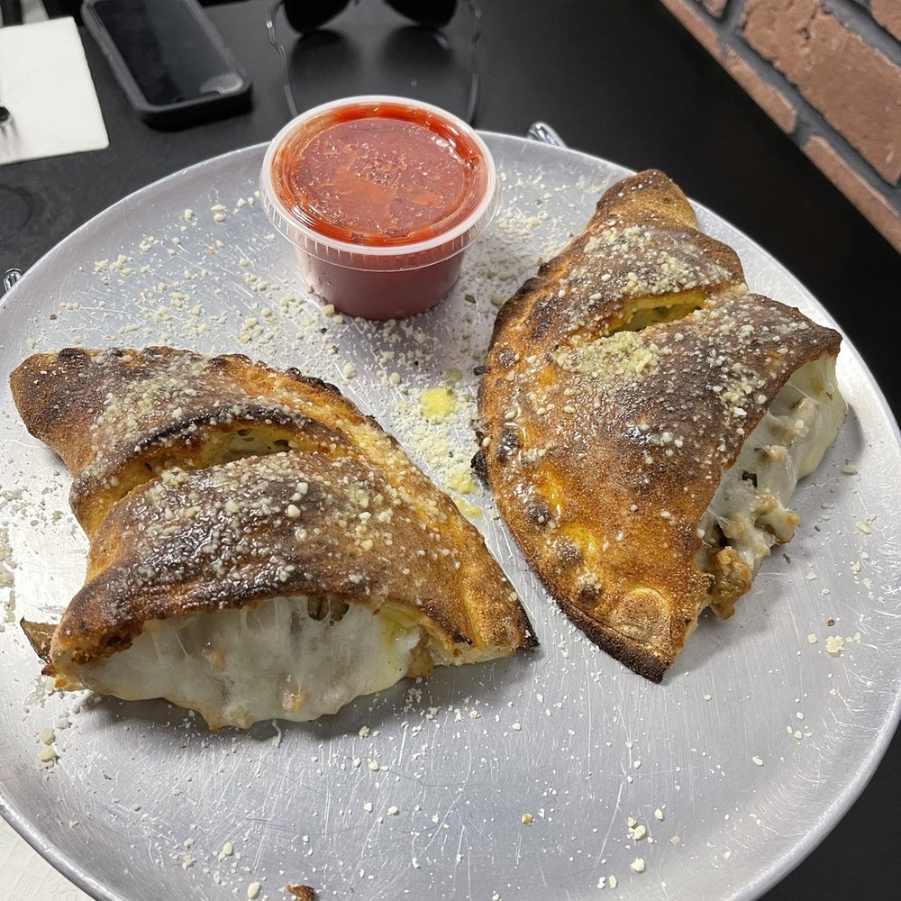 Table Rock Pizza - Calzone with sausage - Pizza Near Me - Millersburg, Ohio Table Rock Pizza - Calzone with sausage - Pizza Near Me - Millersburg, Ohio