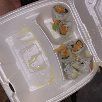 O'Sushi Canton - a person holding a container of sushi - Japanese Near Me - Canton, Michigan