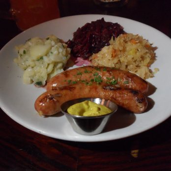 Reichenbach Hall - Käse-Wurst (cheese-filled bratwurst) with potato salad, sweet and sour red cabbage, and sauerkraut. - Bars Near Me - New York, New York Reichenbach Hall - Käse-Wurst (cheese-filled bratwurst) with potato salad, sweet and sour red cabbage, and sauerkraut. - Bars Near Me - New York, New York