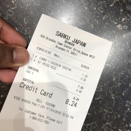 a hand holding a receipt a hand holding a receipt