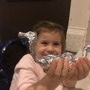 Rodney's On Broadway - The cute dragon shaped foil that held her leftovers - New American Near Me - Georgetown, Kentucky