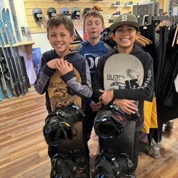 Boys getting rental boards & boots Boys getting rental boards & boots