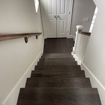Floor It - a staircase leading up to a door - Flooring Near Me Floor It - a staircase leading up to a door - Flooring Near Me