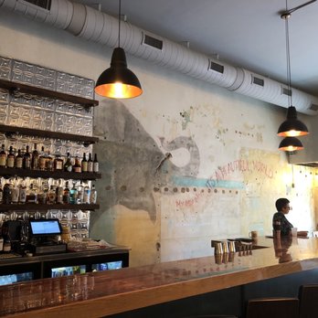 Common Restaurant  - Original art on the walls. - Cocktail Bars Near Me - Savannah, Georgia