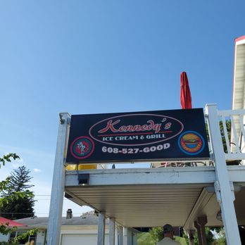 Kennedy's Ice Cream And Grill - a man walking down the sidewalk - Ice Cream & Frozen Yogurt Near Me - New Glarus, Wisconsin Kennedy's Ice Cream And Grill - a man walking down the sidewalk - Ice Cream & Frozen Yogurt Near Me - New Glarus, Wisconsin