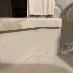 Kitchen Designs - They cut into the stud of the wall to get it to fit, because their quartz slab wasn't cut right. Bends unaligned