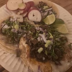 2 asada tacos and 1 asada Volcan