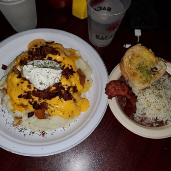 Copper Monkey Grill - Whitney special on left and red beans and ride with sausage and bread on right - Dive Bars Near Me - New Orleans, Louisiana Copper Monkey Grill - Whitney special on left and red beans and ride with sausage and bread on right - Dive Bars Near Me - New Orleans, Louisiana