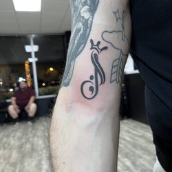 Masterpiece Tattoo Studio - J semi colon tattoo with crown