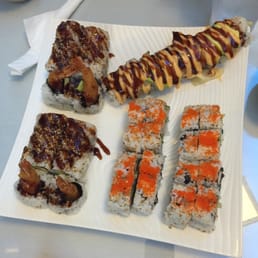 a plate of sushi and rolls a plate of sushi and rolls