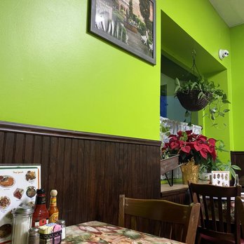 Huaraches Moroleon - a table and chairs in a restaurant - Mexican Near Me - Urbana, Illinois Huaraches Moroleon - a table and chairs in a restaurant - Mexican Near Me - Urbana, Illinois