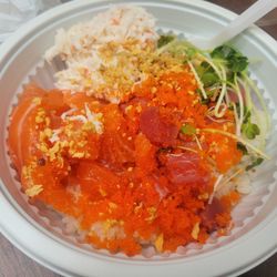 Sake Sushi - Small Poke bowl wirh Salmon and Tuna and Smelt eggs, and Baby Sprouts.