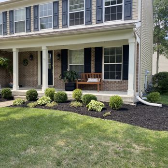 LA Services - the front of a home with landscaping - Lawn Services Near Me