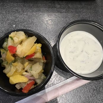Baumhower's Victory Grille - Troy - Side of cilantro sour cream and mango slaw that came with Char Grilled Jamaican Jerk Chicken - Sports Bars Near Me - Troy, Alabama