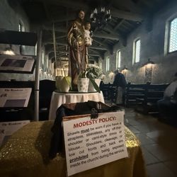San Secondo d'Asti Catholic Church - Did you forget to cover up those bare shoulders ? Borrow a shawl here.