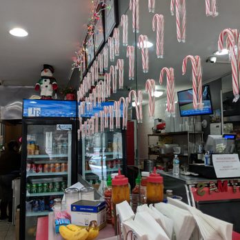 Bocado Express - Cute Christmas decorations. The inside is surrounded by mirrors - Delis Near Me - West New York, New Jersey