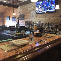 a bar with a large screen tv