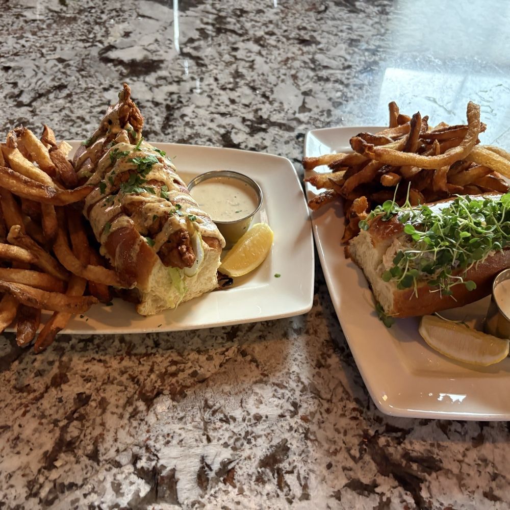 Taylor Shellfish Oyster Bar - Left: Oyster Po' Boy Right: Dungeness Crab Roll - Seafood Near Me - Seattle, Washington Taylor Shellfish Oyster Bar - Left: Oyster Po' Boy Right: Dungeness Crab Roll - Seafood Near Me - Seattle, Washington