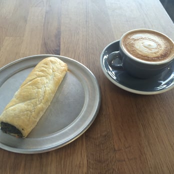 Waltzing Kangaroo - spinach and feta wrap, and flat white - Bakeries Near Me - Fort Collins, Colorado