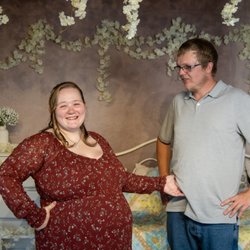 Faded Imagery LLC - A shared laugh during a couples maternity session, photographed by Faded Imagery LLC.