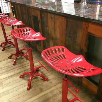 The Den at Harry's Hardware - a row of red stools - Pubs Near Me - Cabot, Vermont The Den at Harry's Hardware - a row of red stools - Pubs Near Me - Cabot, Vermont
