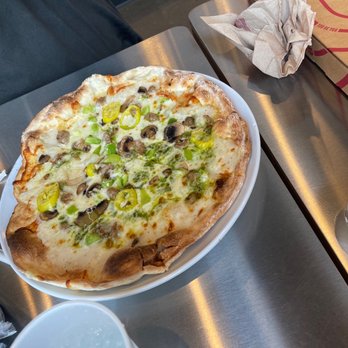 MOD Pizza - a pizza on a white plate - Pizza Near Me - Naperville, Illinois